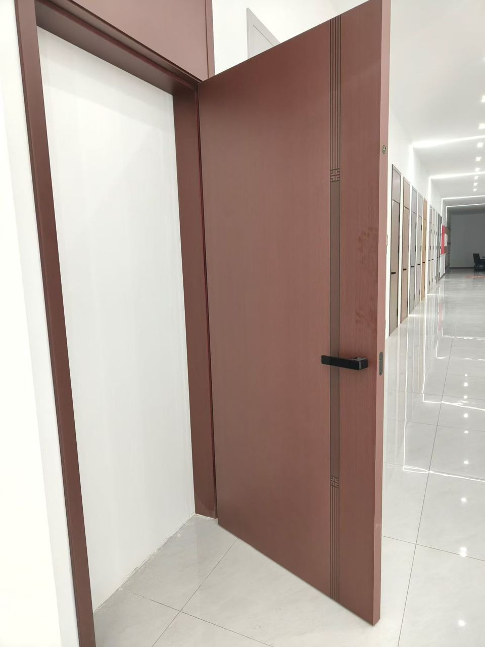 An ANASA mahogany door in a showroom corridor